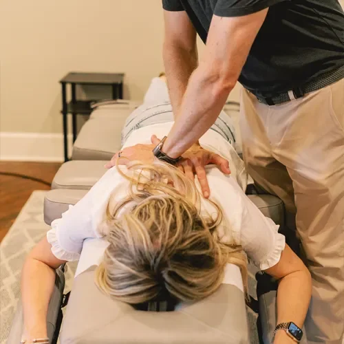Chiropractor Belton TX Jack Wells Adjusting Patient Chiropractor Belton TX Jack Wells Adjusting Patient